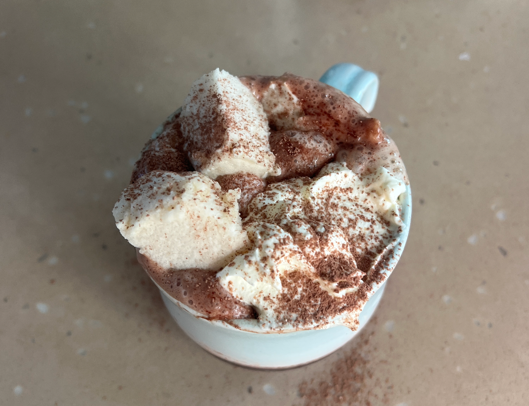 Homemade grass-fed gelatine marshmallows dusted with tapioca flour on a white surface