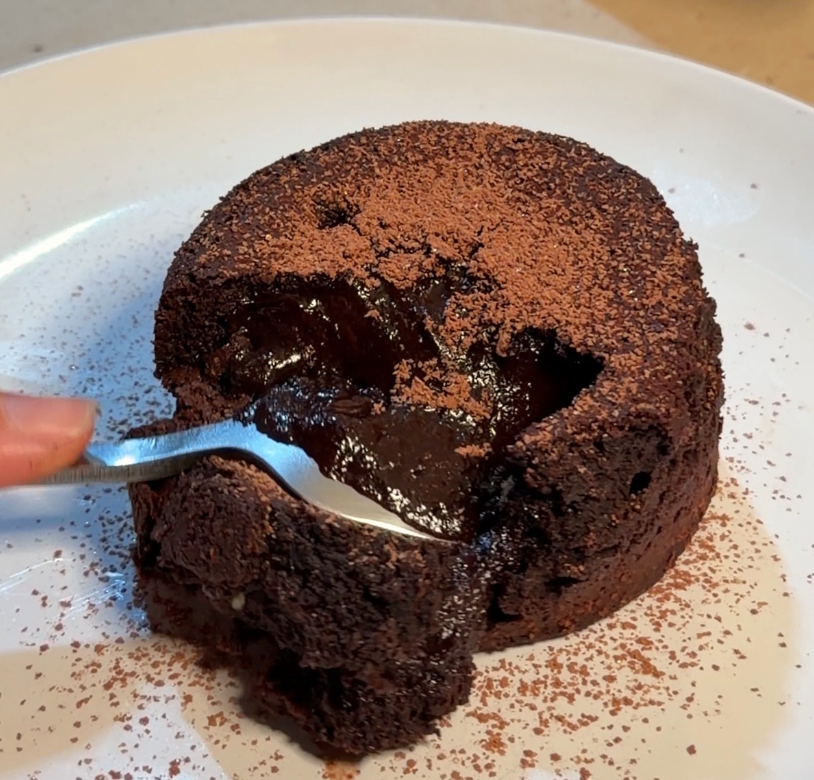 Bone broth cacao chocolate lava cake with a molten centre, dusted with Soulistic cacao powder